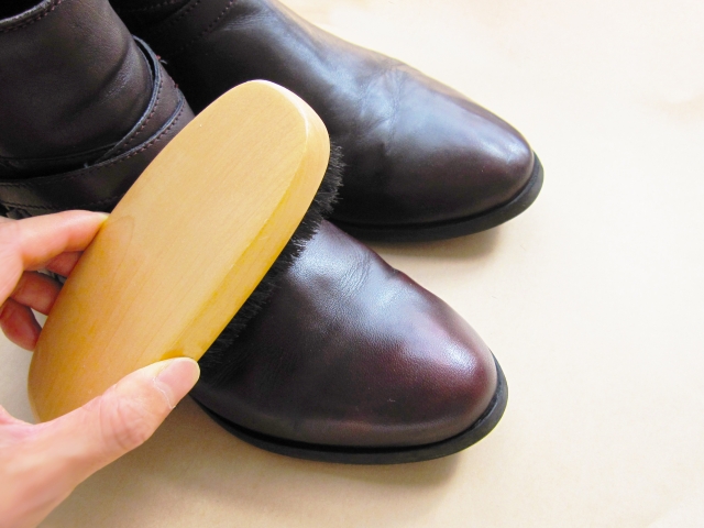 Leather shoes that need polishing maintenance due to minor scratches that have become noticeable while being worn.