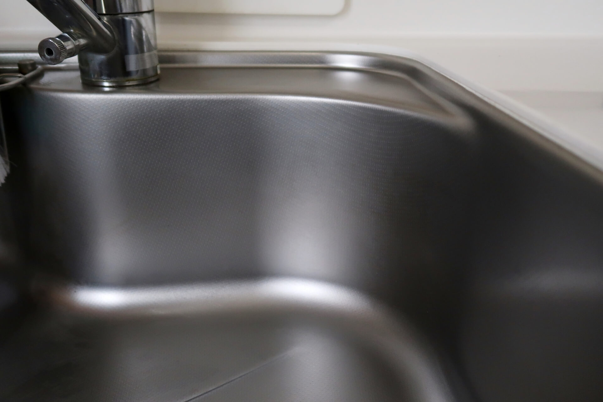 A sink made of polished stainless steel